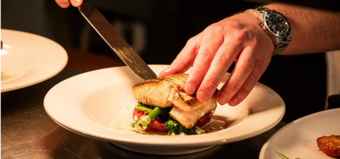 Image of fish being cut on plate