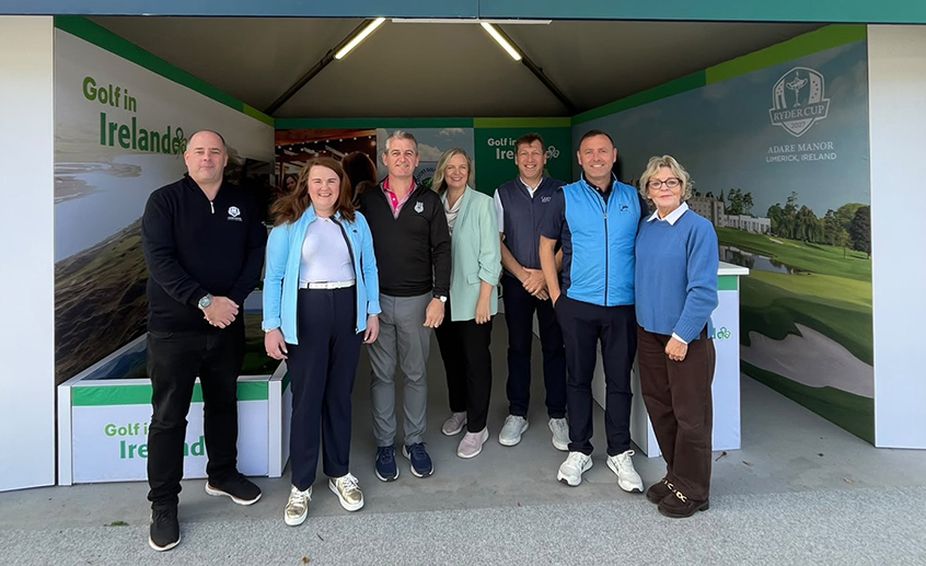 Group of seven people standing in a Golf in Ireland exhibition stand promoting Irish golf tourism and the Ryder Cup at Adare Manor.