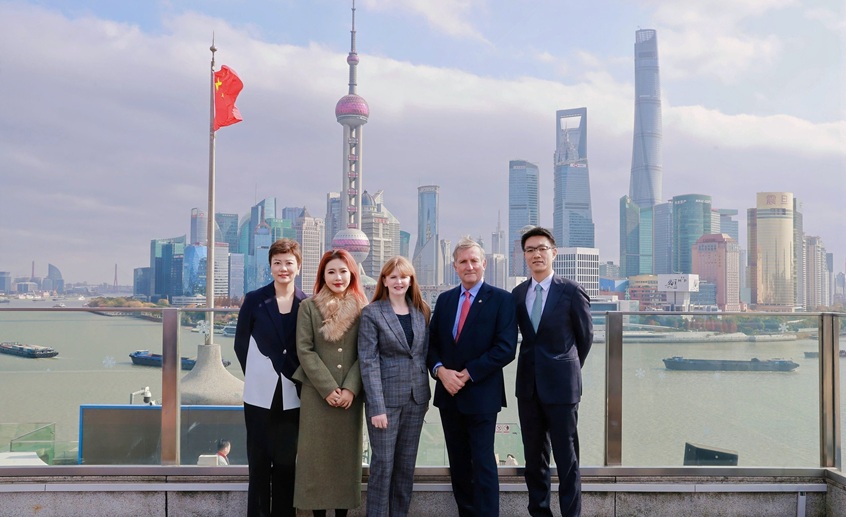 4 people standing in city scene