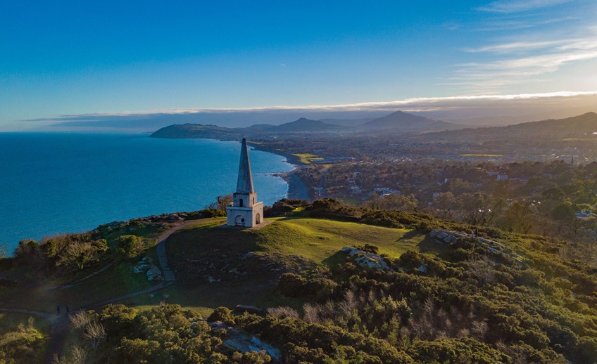 Scenic image with obelisk, mountains and sea of Killiney Hill, Co Dublin.