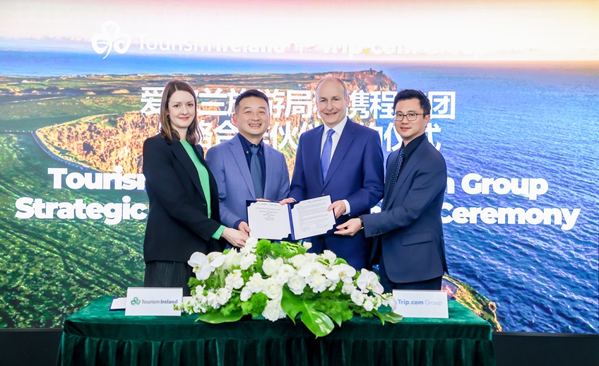 Four people in front of a Tourism Ireland pop up in Shang Hai