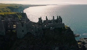 Castle overlooking sea.