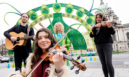 3 musician performing outside city hall in Belfast celebrating St Patrick's Day