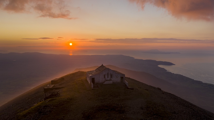 Mountain summit view from above at sunset.