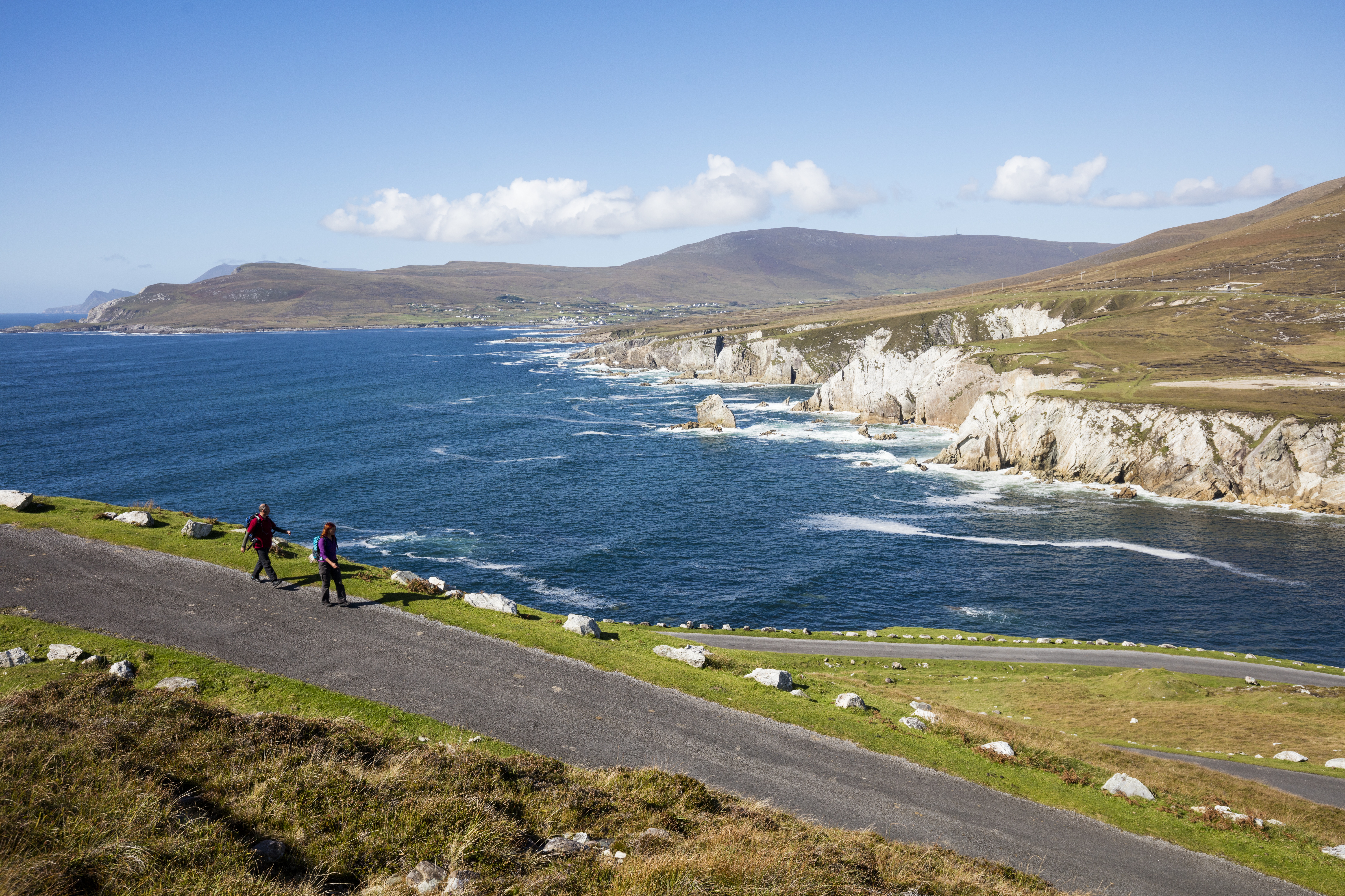 Couple walking above Ashleam Bay, Achill Island, Co Mayo Image of Couple walking above Ashleam Bay, Achill Island, Co Mayo