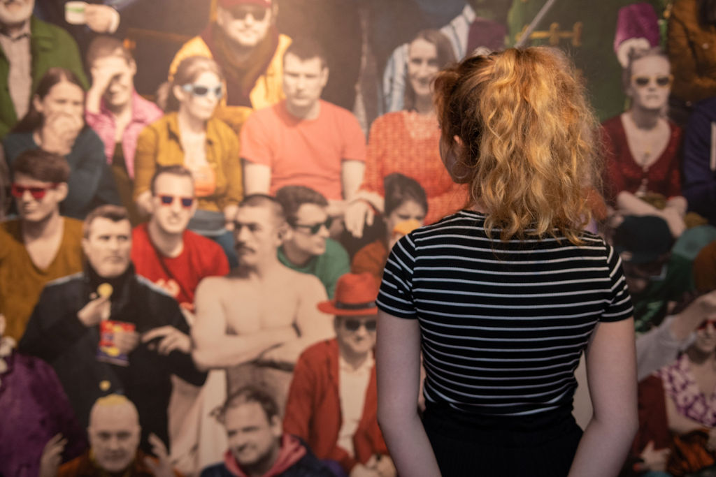 Epic Irish Emigration Museum A girl looking out onto a crowd