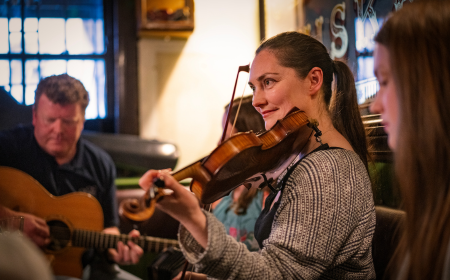 Band playing traditional Irish music in a pub