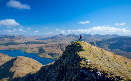 walker on south ridge of mweelrea overlooking killary fjord co mayo